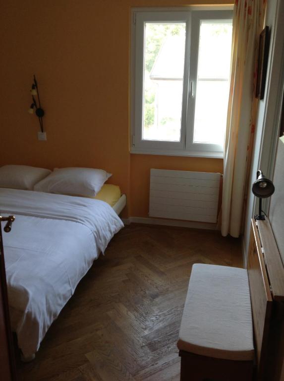 Postel nebo postele na pokoji v ubytování Auberge de Dully