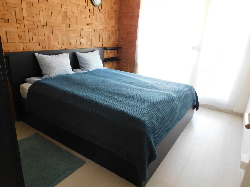 Postel nebo postele na pokoji v ubytování K&K Apartment Siófok