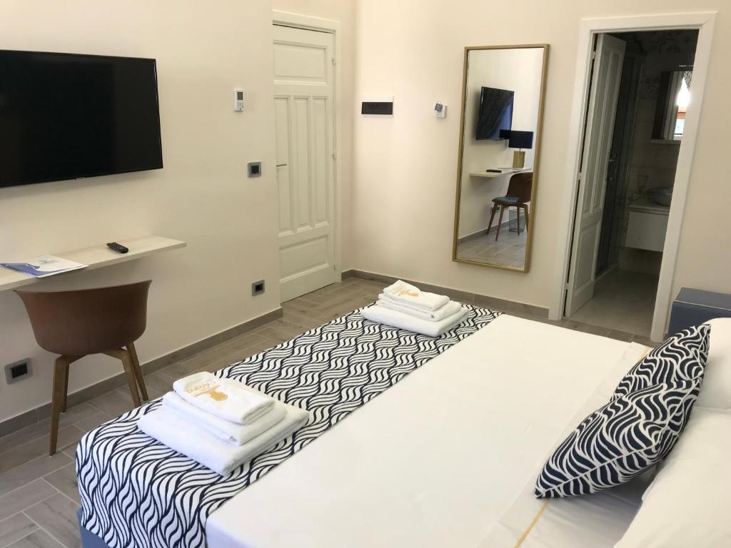 Postel nebo postele na pokoji v ubytování Hotel L'Ariana ISOLE EOLIE - UNA Esperienze
