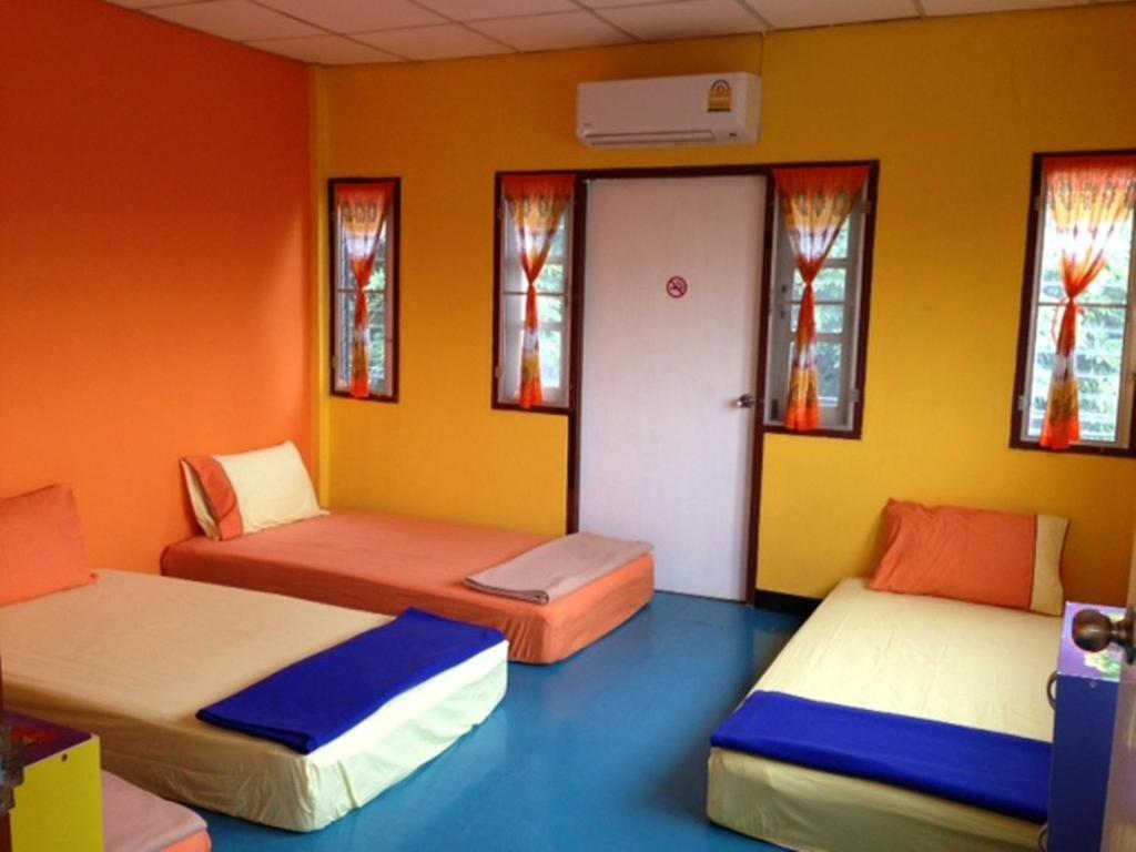 Postel nebo postele na pokoji v ubytování Just Chill Inn
