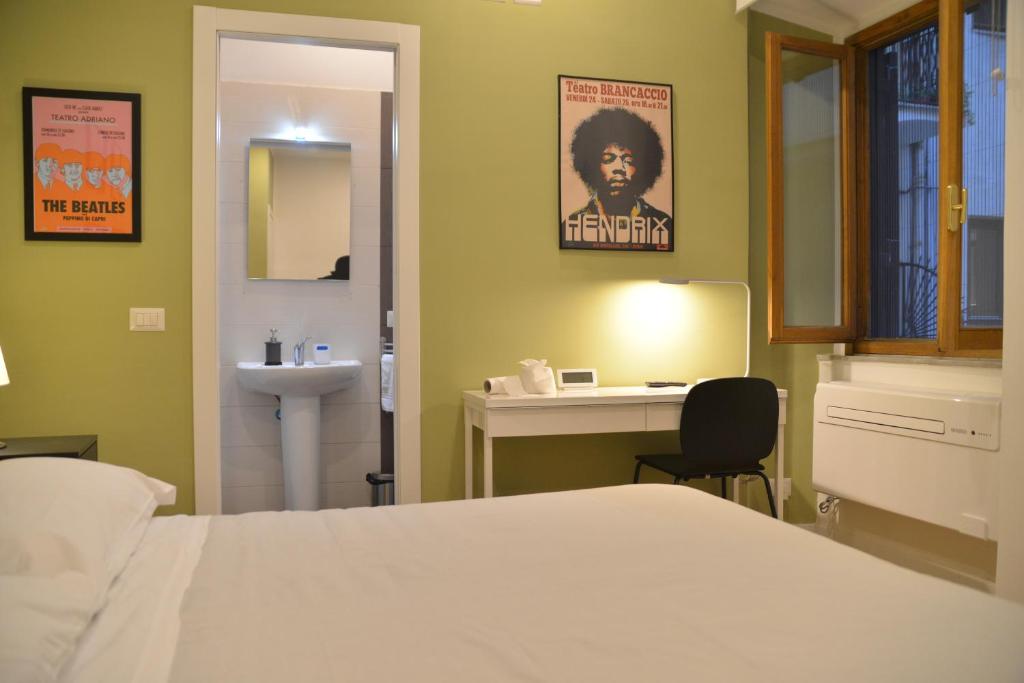 Postel nebo postele na pokoji v ubytování All You Need is Rome Guesthouse