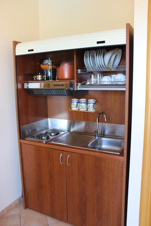 a kitchen with a sink and a stove at Case Vacanze Ancora in Porto Empedocle