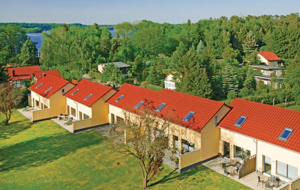 an overhead view of a row of houses with red roofs at 2 Bedroom Amazing Home In Pinnow in Petersberg