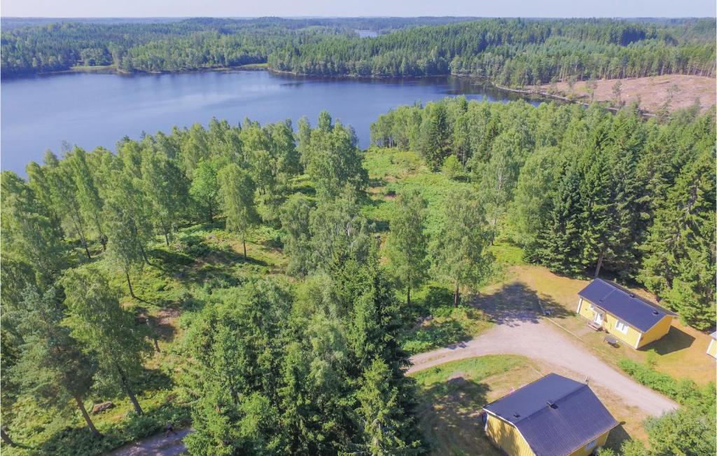 an aerial view of a cabin next to a lake at Beautiful Home In Fegen With House Sea View in Fegen