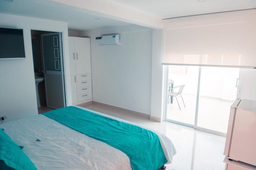 Postel nebo postele na pokoji v ubytování Hotel Casa Arnaldo "Esmeraldas"
