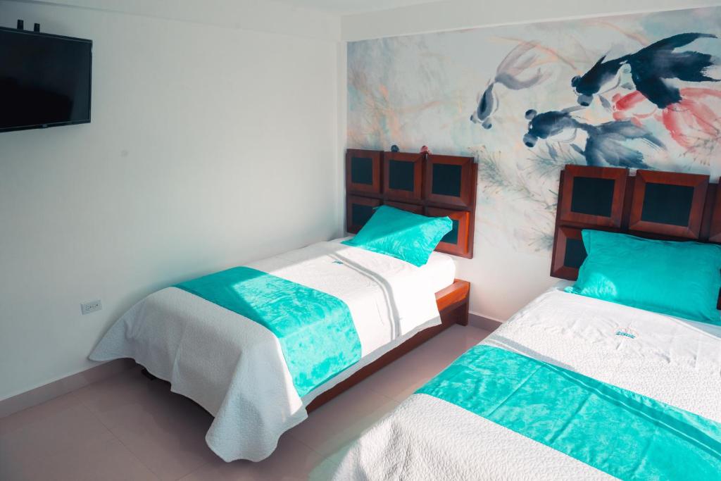 Postel nebo postele na pokoji v ubytování Hotel Casa Arnaldo "Esmeraldas"