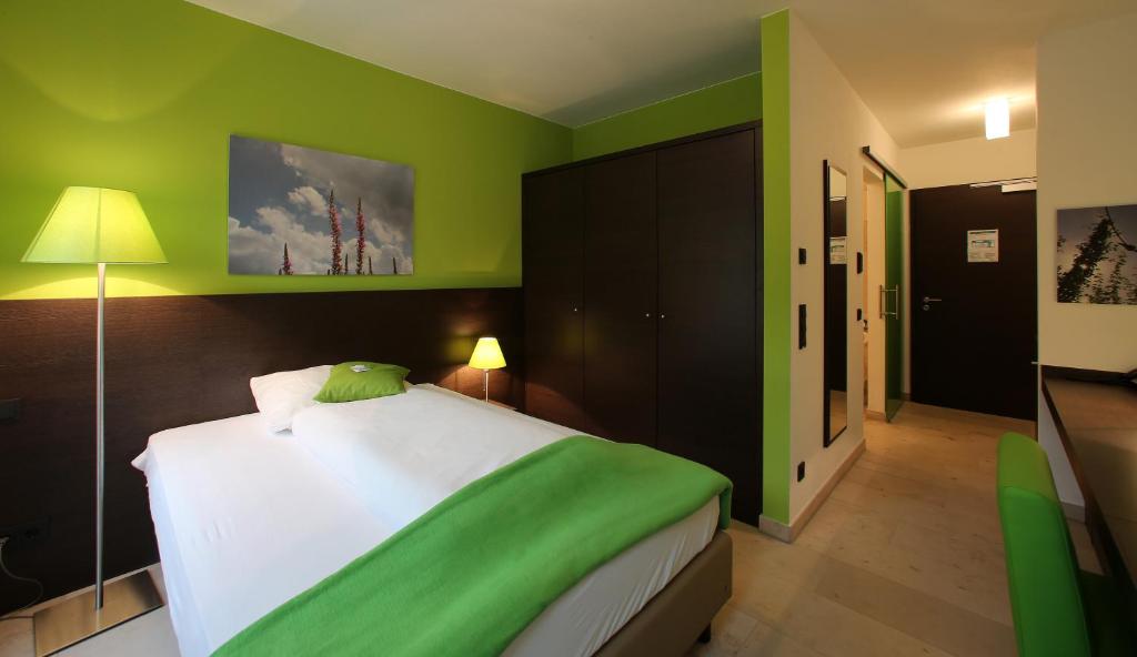 Postel nebo postele na pokoji v ubytování KH Hotel mit Restaurant