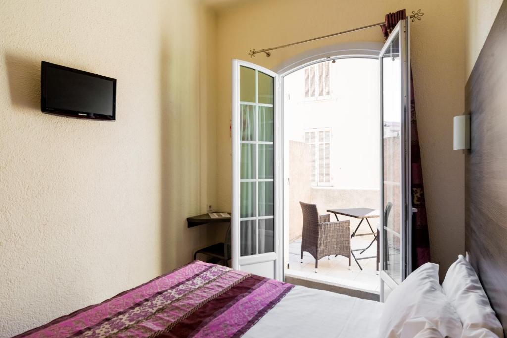 Postel nebo postele na pokoji v ubytování Hotel Le 21