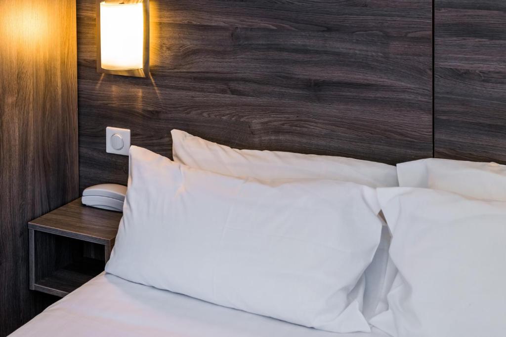 Postel nebo postele na pokoji v ubytování Hotel Le 21