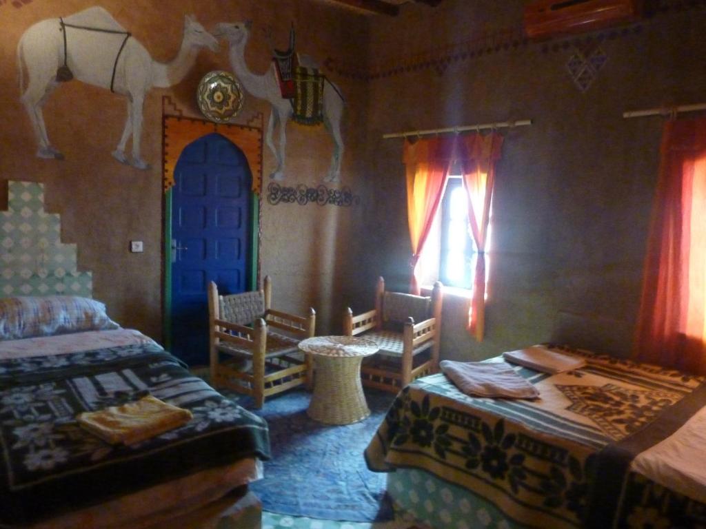 Postel nebo postele na pokoji v ubytování Kasbah Hotel Panorama