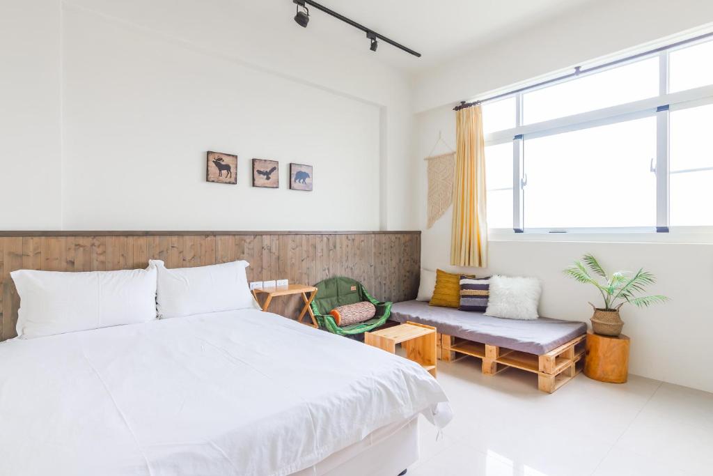 Postel nebo postele na pokoji v ubytování Cozy Green Guesthouse