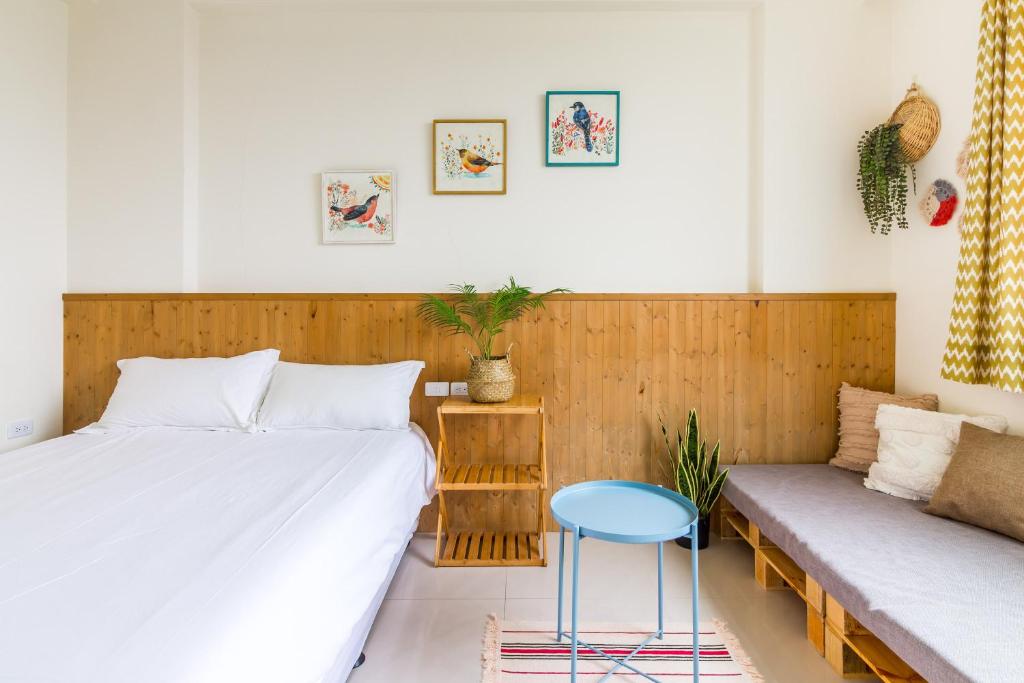 Postel nebo postele na pokoji v ubytování Cozy Green Guesthouse