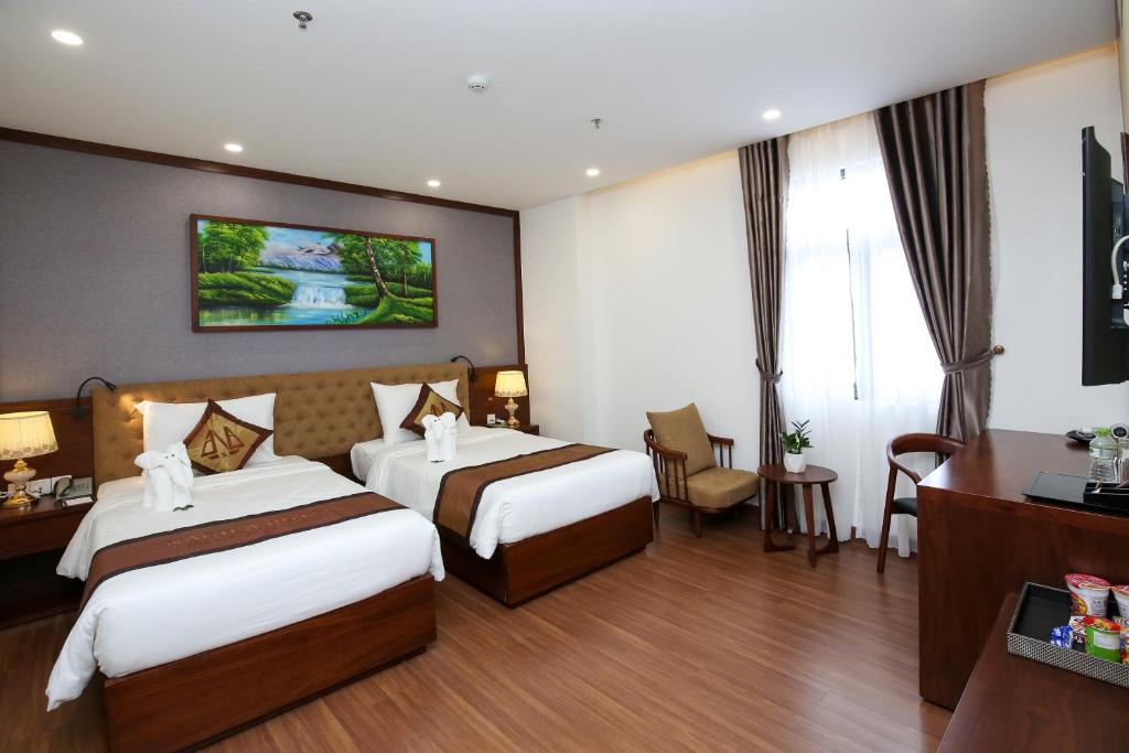 Postel nebo postele na pokoji v ubytování Nagila Boutique Hotel