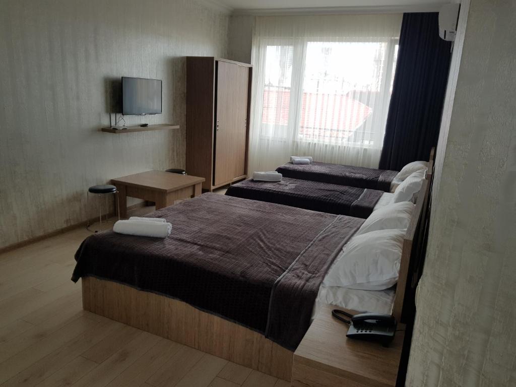 Postel nebo postele na pokoji v ubytování MikePalace