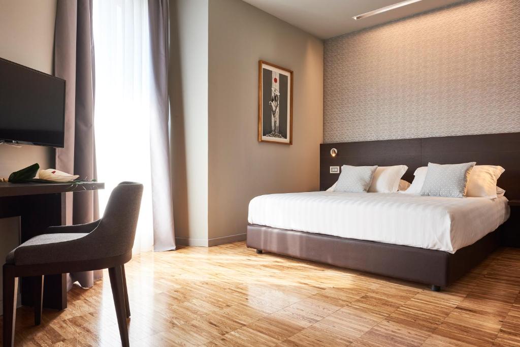 Posteľ alebo postele v izbe v ubytovaní Hotel Michelangelo