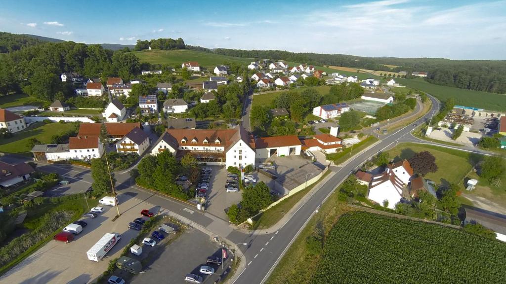 an aerial view of a small town with cars parked at Landhotel Aschenbrenner in Freudenberg