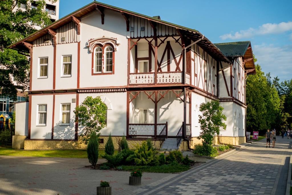 an old house with a half timbered at Villa Viktoriya Hotel in Truskavets
