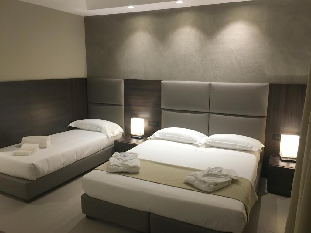 Letto o letti in una camera di Plus Welcome Milano