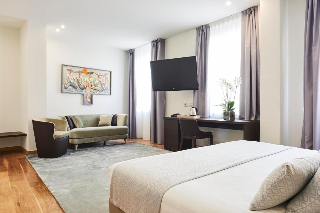 Posteľ alebo postele v izbe v ubytovaní Hotel Michelangelo