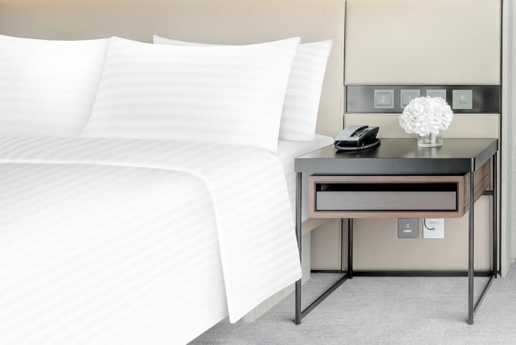 A bed or beds in a room at ALVA HOTEL BY ROYAL