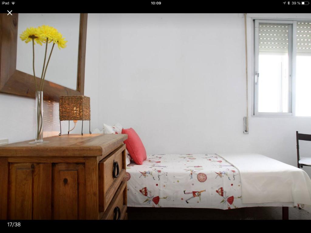 A bed or beds in a room at Golondrina