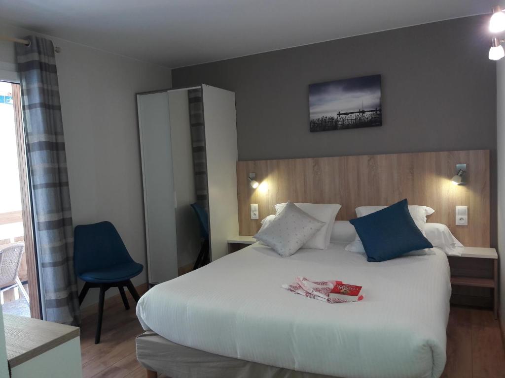 Postel nebo postele na pokoji v ubytování Le Chabi