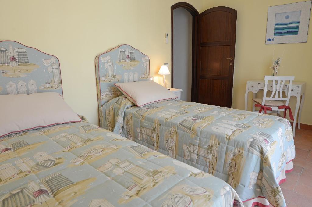 A bed or beds in a room at Villa Il Fortino