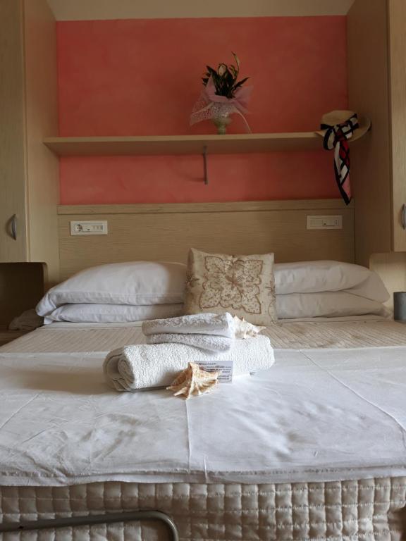 Postel nebo postele na pokoji v ubytování Hotel Maxim