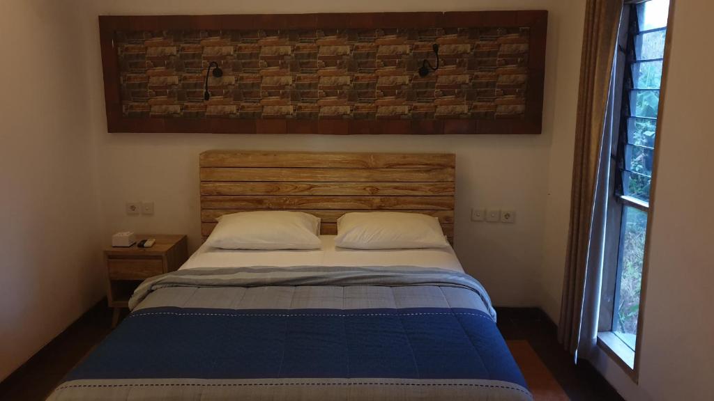 Postel nebo postele na pokoji v ubytování Clover Bali