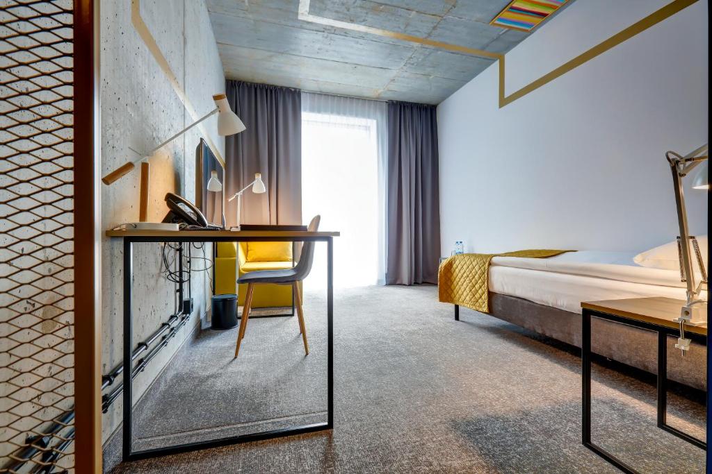 Posteľ alebo postele v izbe v ubytovaní Hotel Arche Geologiczna