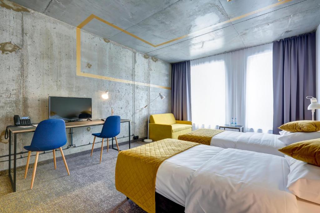 Posteľ alebo postele v izbe v ubytovaní Hotel Arche Geologiczna