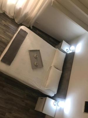 A bed or beds in a room at Giudea Home