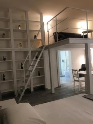 A bed or beds in a room at Giudea Home