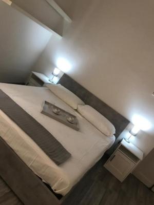 A bed or beds in a room at Giudea Home