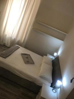 A bed or beds in a room at Giudea Home