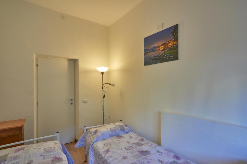 Een bed of bedden in een kamer bij Casa della nonna