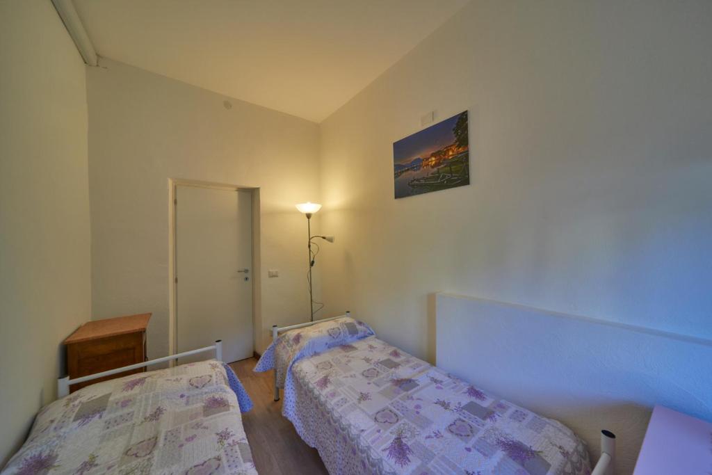 Een bed of bedden in een kamer bij Casa della nonna