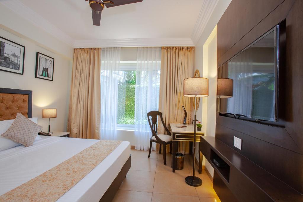 Postel nebo postele na pokoji v ubytování Royale Exotica, Goa