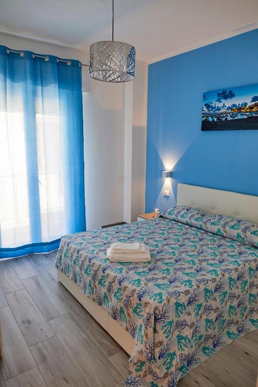 Posteľ alebo postele v izbe v ubytovaní Costa del Golfo