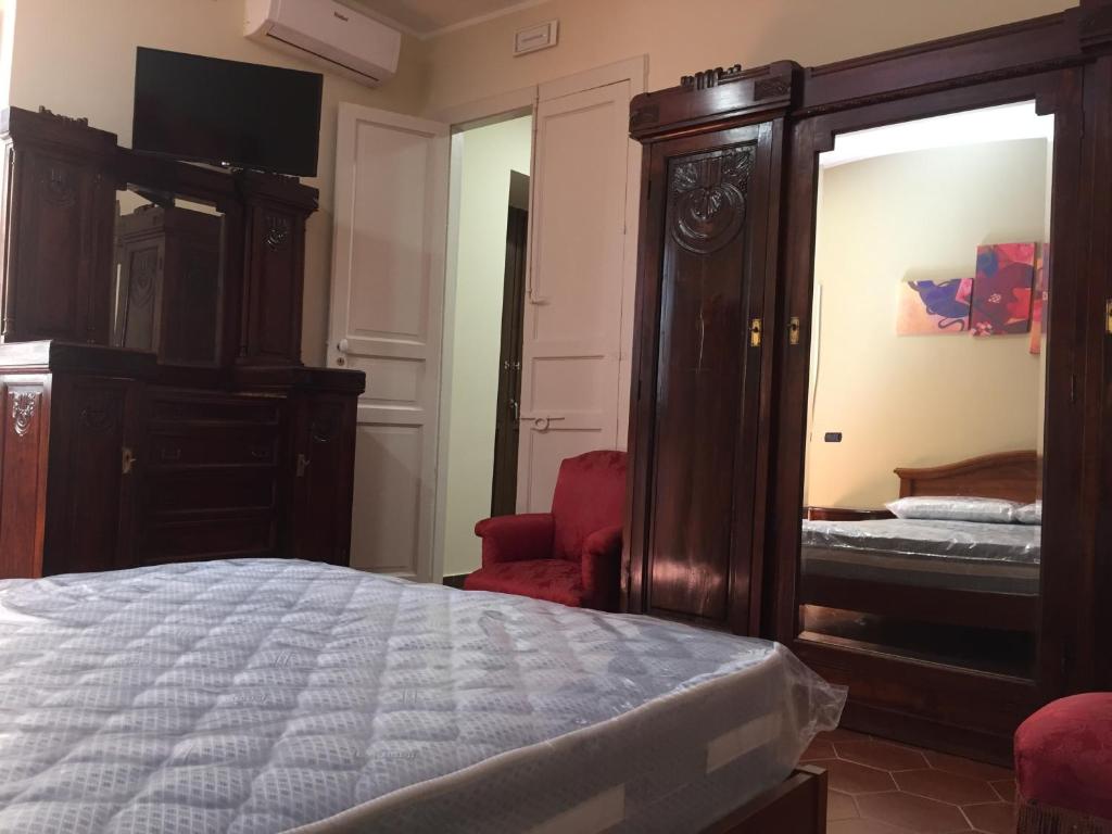 Postel nebo postele na pokoji v ubytování B&B Duomo Pizzo ApartHotel