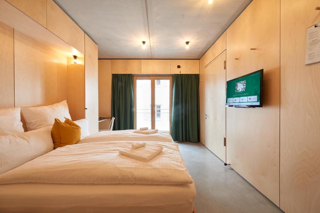 Postel nebo postele na pokoji v ubytování Kitz Boutique Hotel & Restaurant