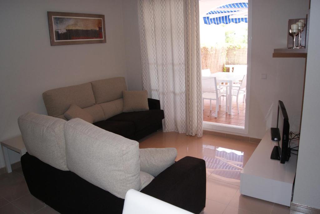 Posedenie v ubytovaní Costa Ballena Cómodo Bajo con Piscina, Patio y 3 Dormitorios Parking free