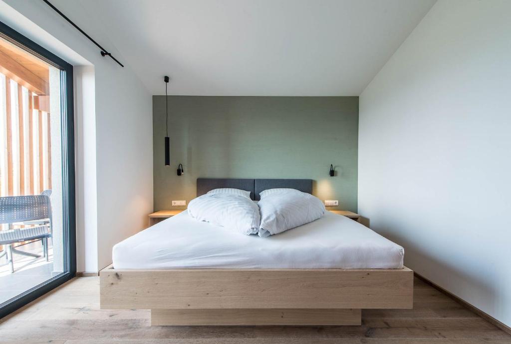Posteľ alebo postele v izbe v ubytovaní Hotel Sonnenheim