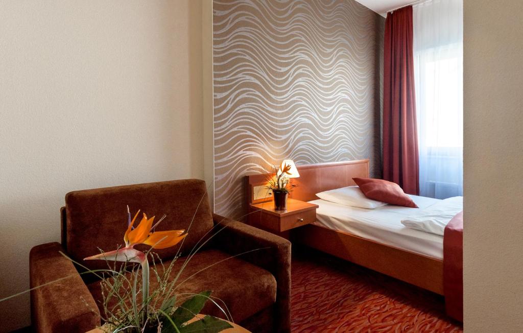 Postel nebo postele na pokoji v ubytování Club Hotel Cortina