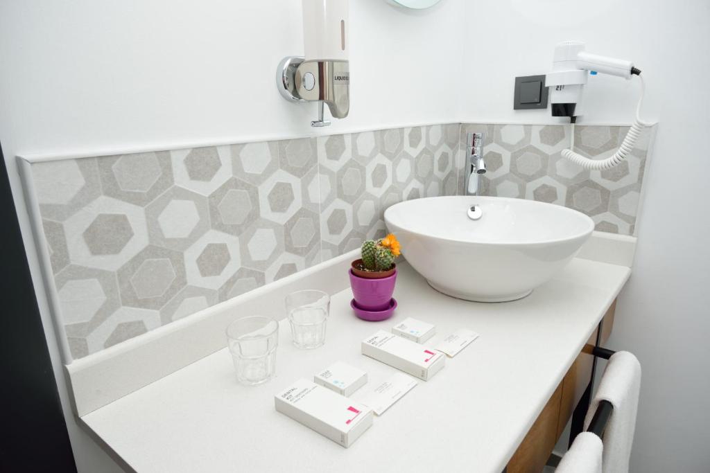 Koupelna v ubytování Hotel Adora
