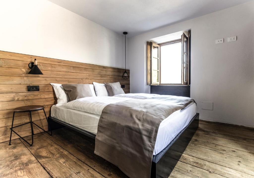 Postel nebo postele na pokoji v ubytování Casa Pasini-Foresteria