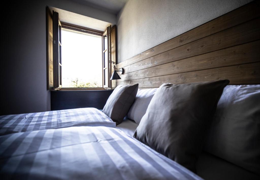 Postel nebo postele na pokoji v ubytování Casa Pasini-Foresteria