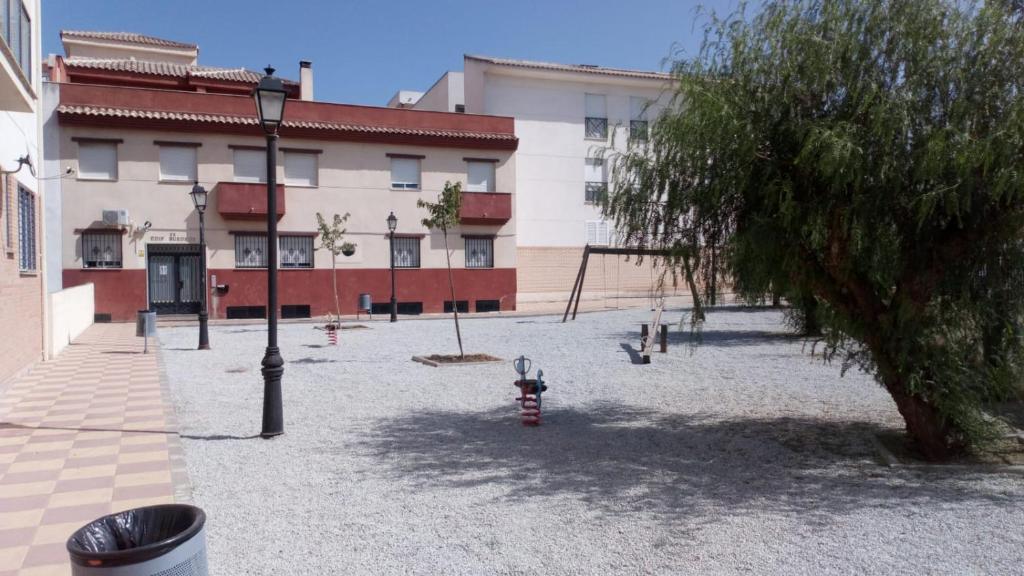 a courtyard in front of a building with a fire hydrant at Apartamento Pergar II Alojamiento para empresas-WIFI 4 Personas in Las Gabias