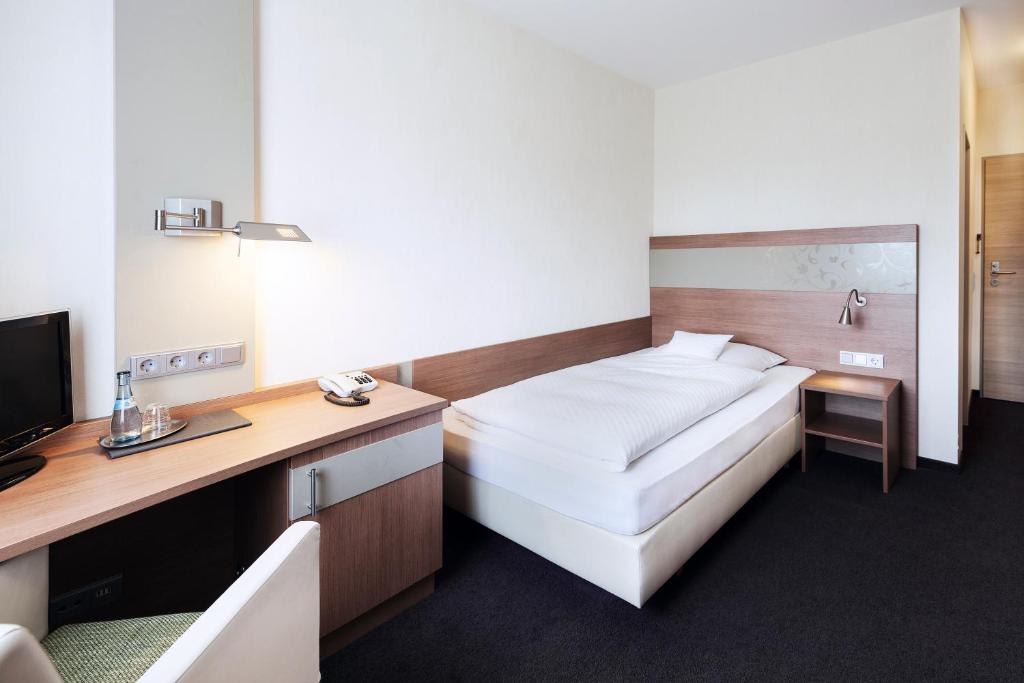 Postel nebo postele na pokoji v ubytování Hotel Rieth