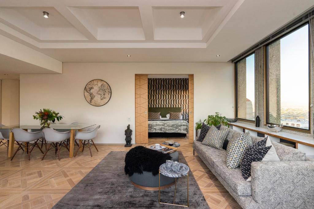 a living room with a couch and a table at #1803 Cartwright - Simply Spectacular in Cape Town